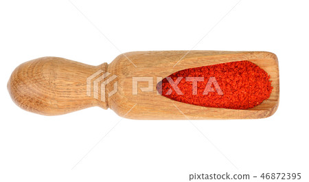 sweet paprika spice in a wooden spoon isolated on white background. Top view. Flat lay sweet paprika spice in a wooden spoon isolated on white background. Top view. Flat lay 46872395