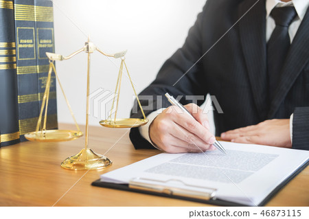 tribunal Attorney lawyer working with documents and wooden gavel tribunal Attorney lawyer working with documents and wooden gavel 46873115