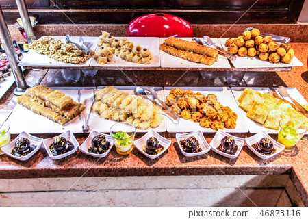 Large platters of middle eastern sweets dessert, baklava, pastry, honey, nuts, celebration feast in 46873116