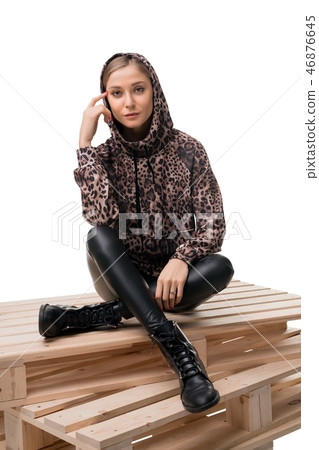 Young blonde in bomber and leather jeggings view Young blonde in bomber and leather jeggings view 46876645