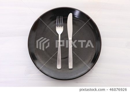 Sign for the end of the meal by the cutlery Sign for the end of the meal by the cutlery 46876926
