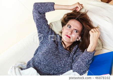 Woman suffering from head pain taking power nap Woman suffering from head pain taking power nap 46878102