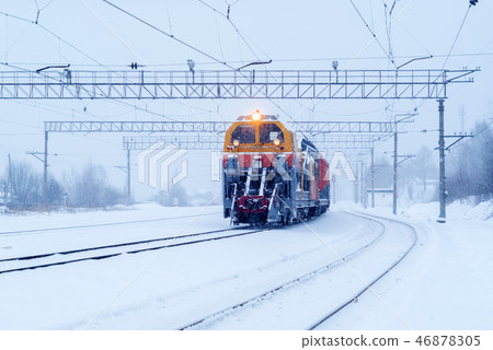 railway snow machine at station during snowfall railway snow machine at station during snowfall 46878305