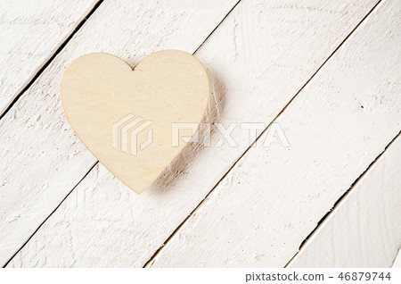 Wood heart shape on a vintage wooden background. 46879744