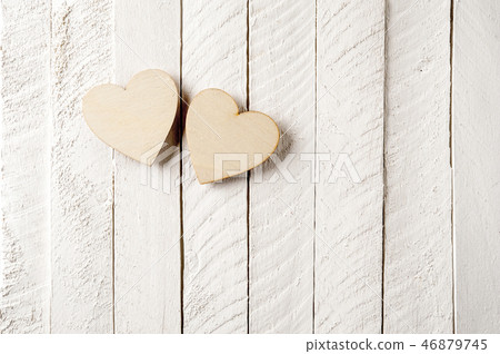 Two wood heart on a vintage wooden background. 46879745