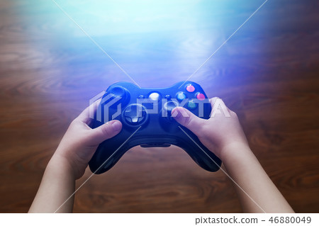 Video game controller in children's hands, in TV Video game controller in children's hands, in TV 46880049