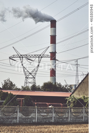 Transmission tower and smoky chimney. Transmission tower and smoky chimney. 46880948