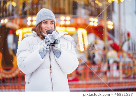 Outdoors lifestyle fashion portrait of stunning blonde girl walking on the holiday city. Smiling Outdoors lifestyle fashion portrait of stunning blonde girl walking on the holiday city. Smiling 46881557