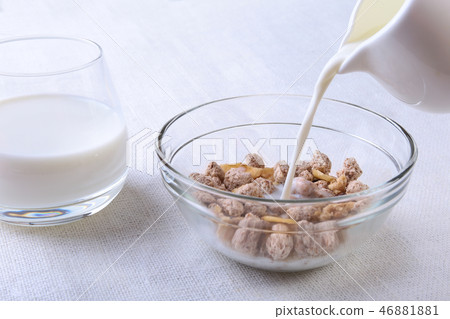 Healthy food with Corn Flakes cereal in a bowl, apple, banana and glass with milk. Morning breakfast Healthy food with Corn Flakes cereal in a bowl, apple, banana and glass with milk. Morning breakfast 46881881