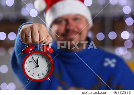 Bearded smiling man wearing warm blue sweater 46882888