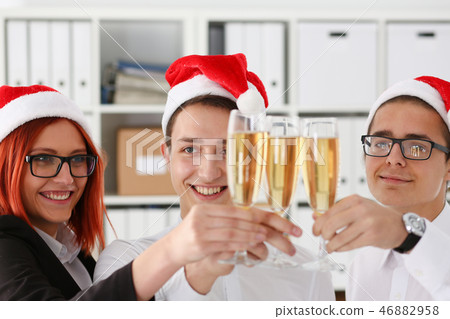 A group of businesspeople celebrating Christmas A group of businesspeople celebrating Christmas 46882958