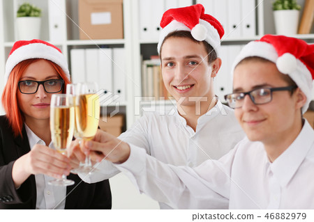 A group of businesspeople celebrating Christmas A group of businesspeople celebrating Christmas 46882979