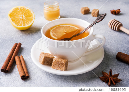 Cup of tea with lemon and brown sugar, cinnamon  46883695