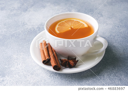 Cup of tea with lemon and brown sugar, cinnamon  46883697
