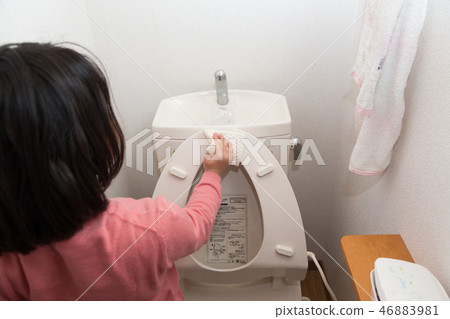 Girl cleaning the toilet Girl cleaning the toilet 46883981