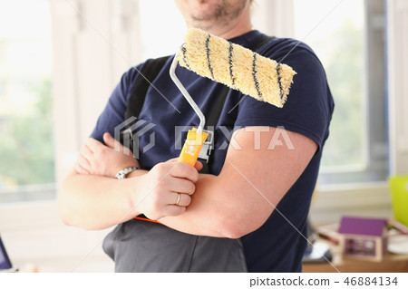 Smiling worker hold brush portrait Smiling worker hold brush portrait 46884134