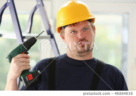 Idiot worker using electric drill portrait Idiot worker using electric drill portrait 46884638