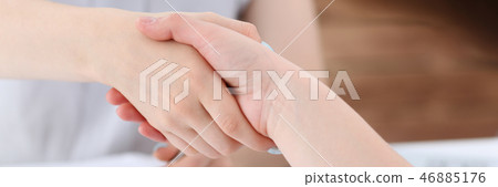 Business woman and woman shake hands Business woman and woman shake hands 46885176
