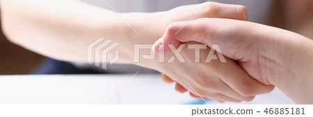 Business woman and woman shake hands Business woman and woman shake hands 46885181