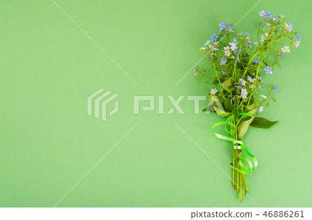 Small bouquet with blue flowers 46886261