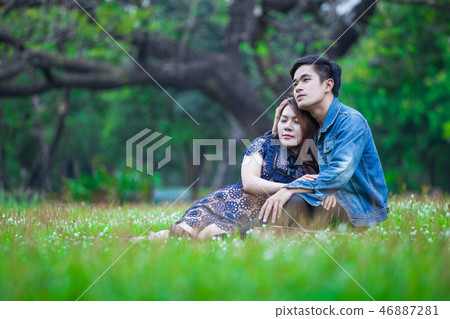 Couple love sitting and relax embracing each othe Couple love sitting and relax embracing each othe 46887281