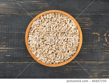 Sunflower seeds in bowl 46887330