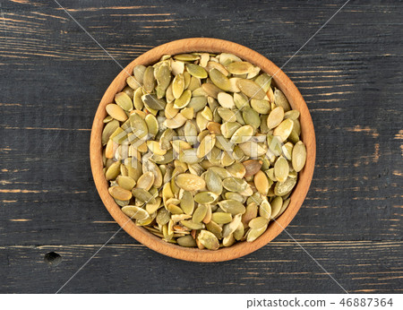 Pumpkin seed kernels in bowl Pumpkin seed kernels in bowl 46887364