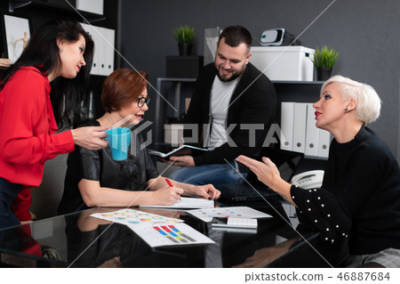 Office workers discuss their project over Cup of tea Office workers discuss their project over Cup of tea 46887684