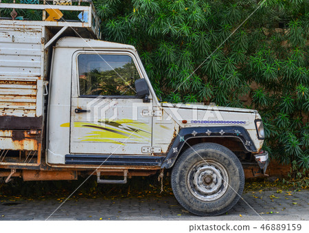 A small truck parking on street 46889159