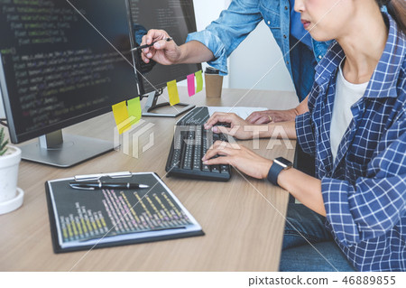 Two professional programmers cooperating at Developing programmi 46889855