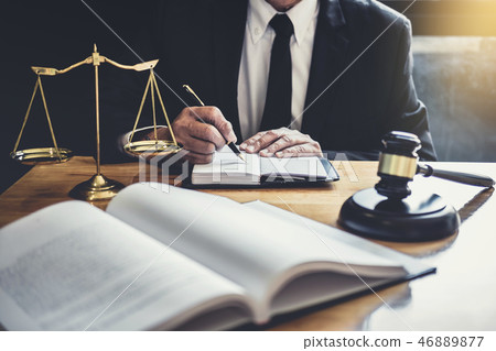 Male lawyer or judge working with contract papers, Law books and Male lawyer or judge working with contract papers, Law books and 46889877