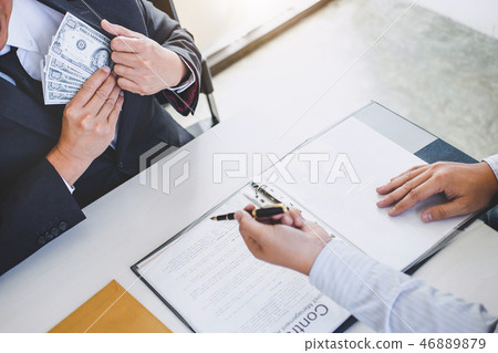 Bribery and corruption concept, bribe in the form of dollar bill Bribery and corruption concept, bribe in the form of dollar bill 46889879