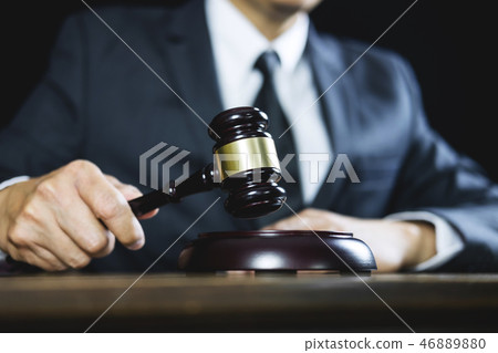 Counselor or Male lawyer working on courtroom sitting at the tab Counselor or Male lawyer working on courtroom sitting at the tab 46889880