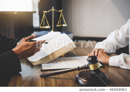 Businesswoman and Male lawyer or judge consult having team meeti Businesswoman and Male lawyer or judge consult having team meeti 46889963