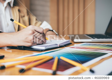 Creative graphic designer using graphics tablet to choosing colo 46889969