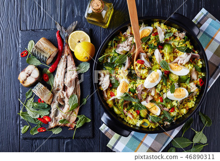 Kedgeree with flaked hot smoked fish, flatlay 46890311