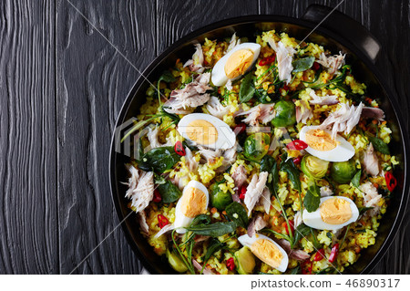 Kedgeree with flaked smoked fish, top view 46890317