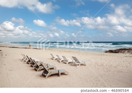 Sun beds on the beach on Cozumel Island. Mexico 46890584