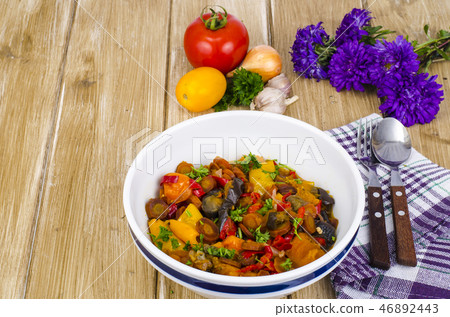 Ragout of vegetables in bowl on wooden table 46892443