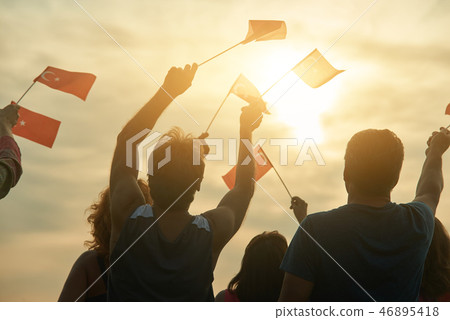 Back view close up mature men with turkish flags. 46895418
