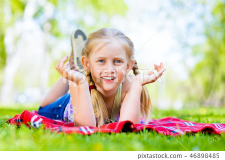portrait of a smiling girl in a park portrait of a smiling girl in a park 46898485