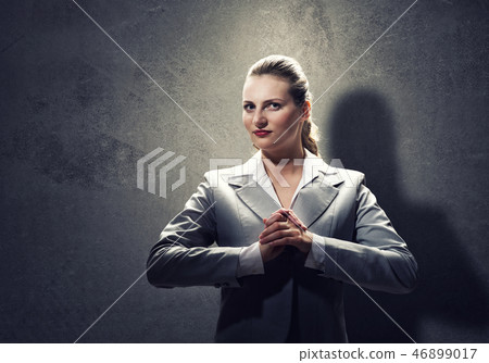 Praying businesswoman 46899017