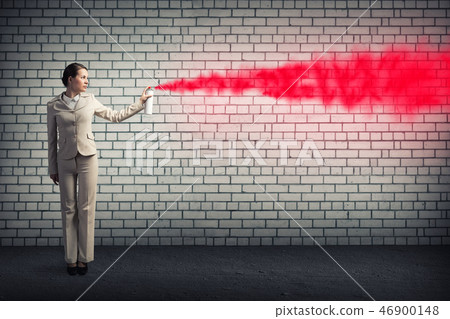 Woman using spray Woman using spray 46900148