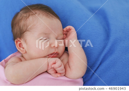 portrait of a little girl: baby's face close-up 46901943