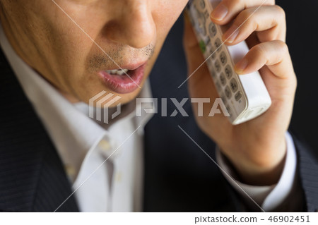Surprised innocent businessman on the phone 46902451