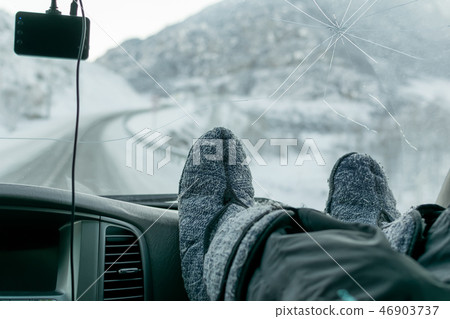 human feet on the background of glass in the car 46903737