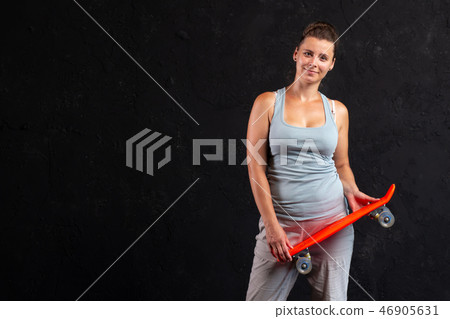 Teen girl with skateboard 46905631