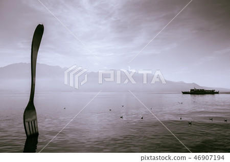 Lake Geneva shore with The Fork of Vevey statue 46907194