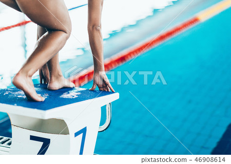 Swimmer on starting block 46908614