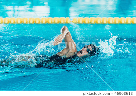 Front crawl swimmer in the pool 46908618